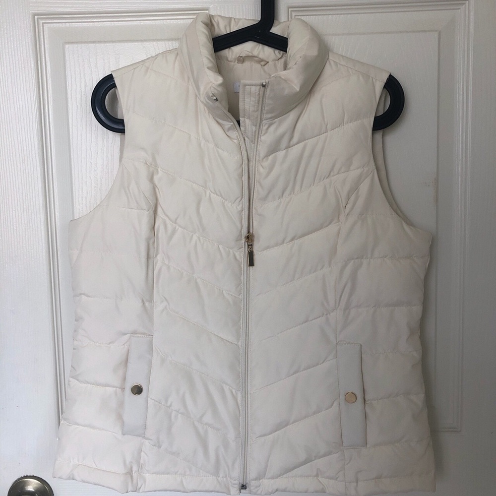 cream colored sleeveless puffer coat